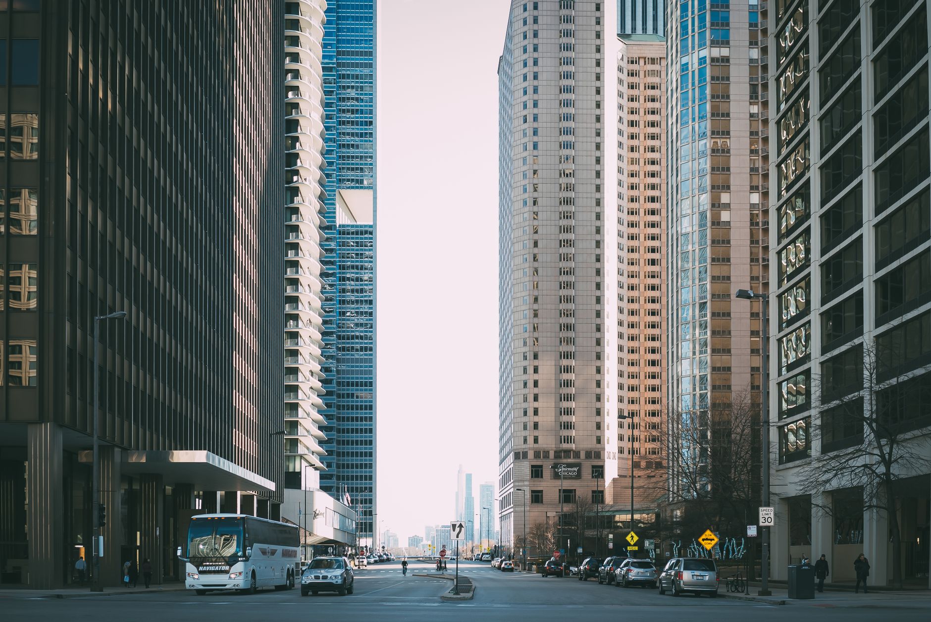 Vibrant city street scene with tall skyscrapers and city life full of cars and pedestrians. — An Investigative Look into Ster