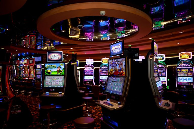 Vibrant casino floor with colorful slot machines and bright lights capturing a lively gaming atmosphere. — Don’t Miss Today’s