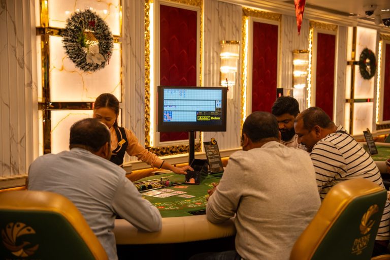 A group of adults playing at a casino table in Goa, India, captured indoors with festive decor. — Get Started in Seconds with