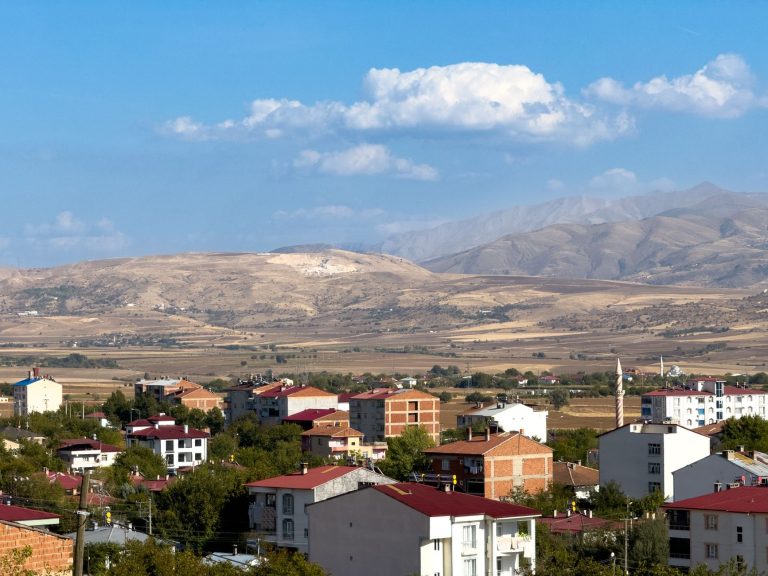 A picturesque view of Kovancılar, Elazığ with red-roofed houses and mountain landscape. — How to Stay Safe and Find Real Conn