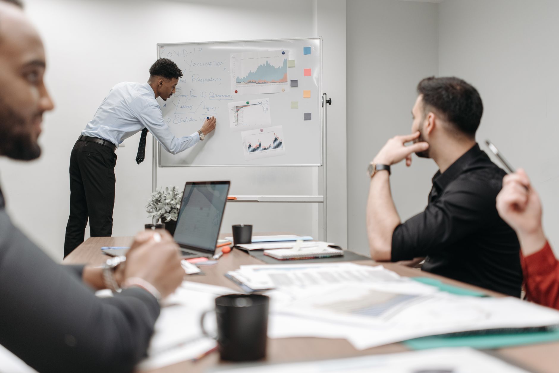 Colleagues in a business meeting discussing data and strategies at the office. — Make sure You Get Quality Prints with an Onl