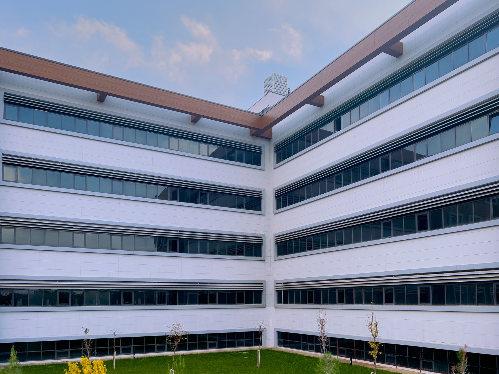 Contemporary office building featuring sleek glass windows and minimalist design. — Connect on a Deeper Level with Lo