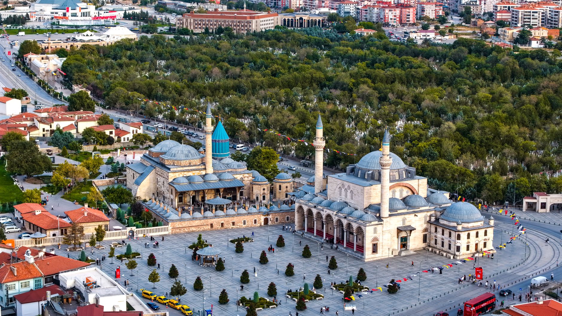 Vibrant aerial view of the iconic Mevlana Museum located in Konya, Türkiye, surrounded by lush greenery. — Safety and