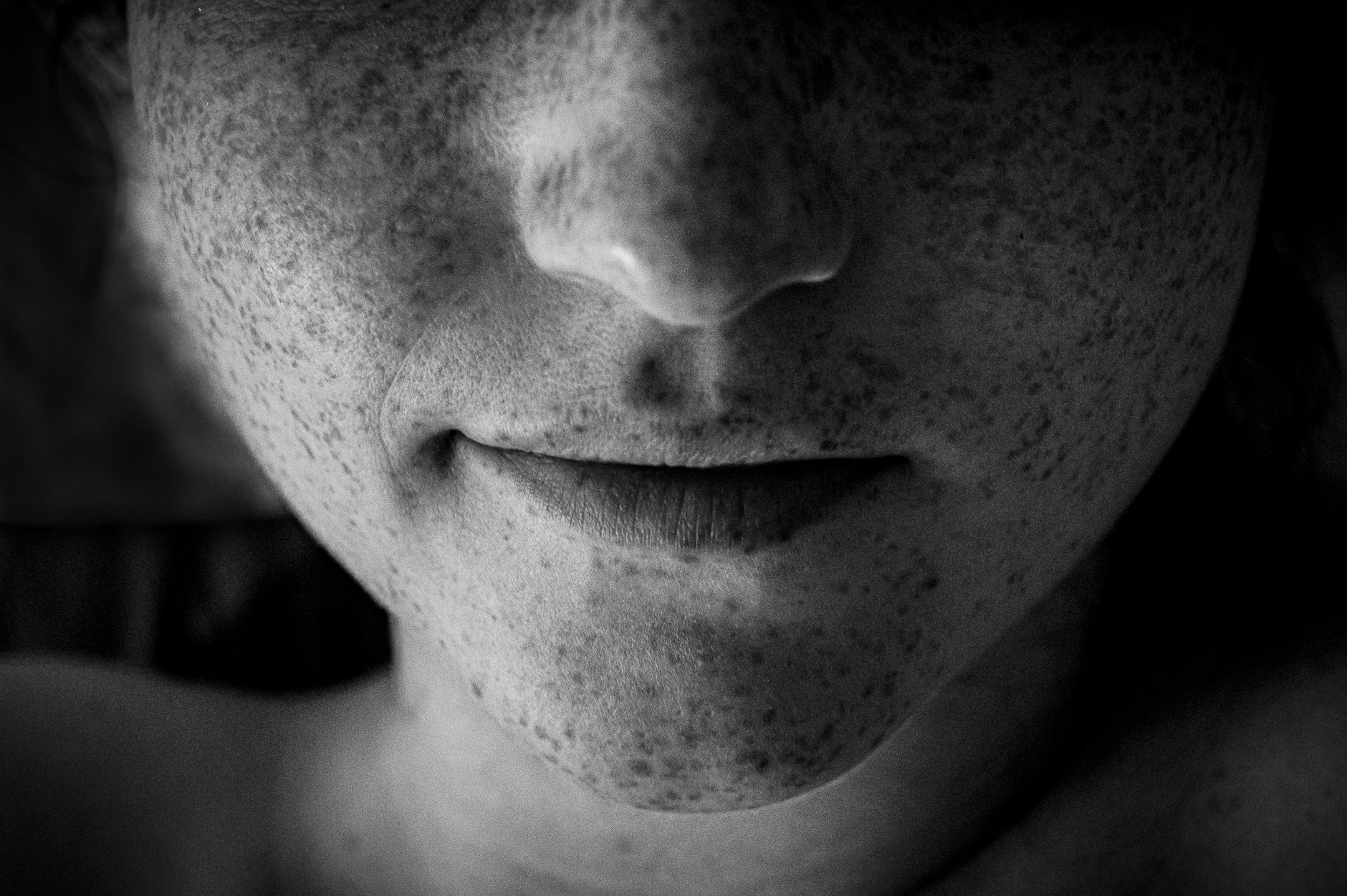 Artistic black and white close-up of a face highlighting freckles and lips. — The Benefits Of Aged care cleaning Sydney- Your