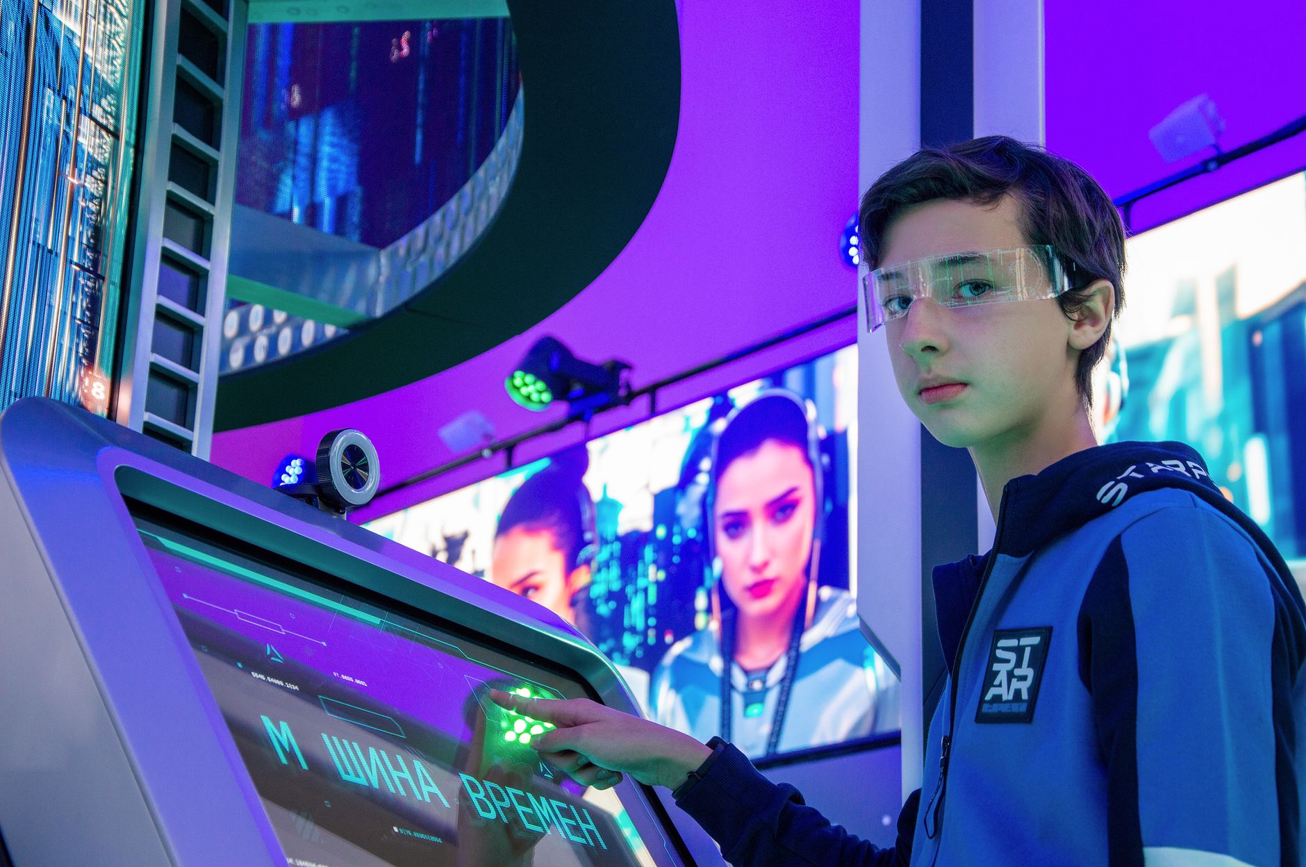 Teen boy in a digital room interacting with a futuristic touchscreen device wearing protective goggles. — The Best Way To Get