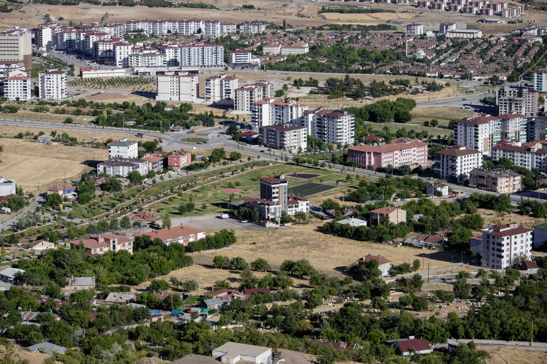 Aerial cityscape of Elâzığ, Türkiye showcasing apartments and greenery in summer. — The Different Types of Baccarat Games