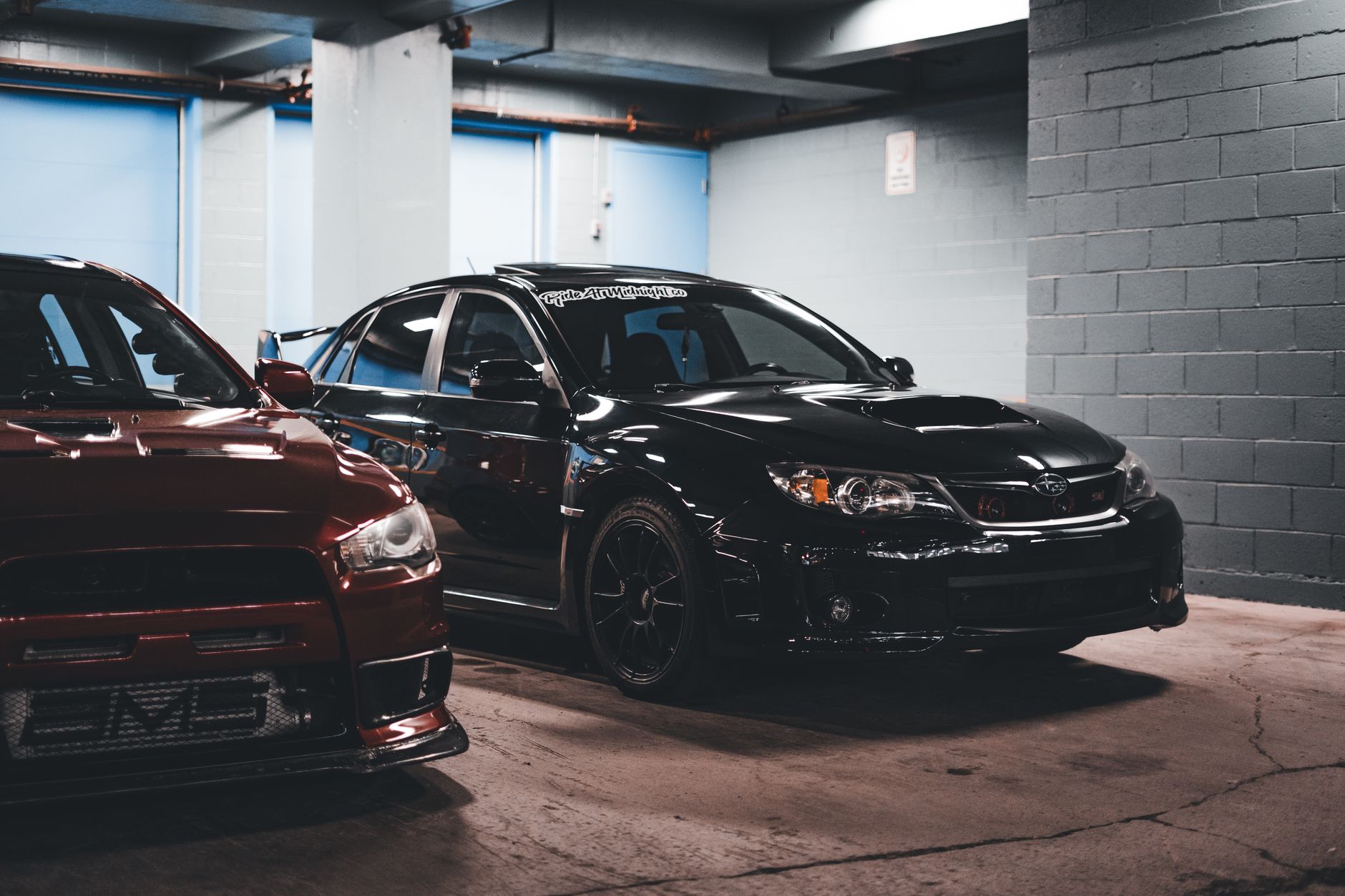 Two sports cars stylishly parked in an urban garage, showcasing modern automotive design. — The How Will You Calculate bijtel
