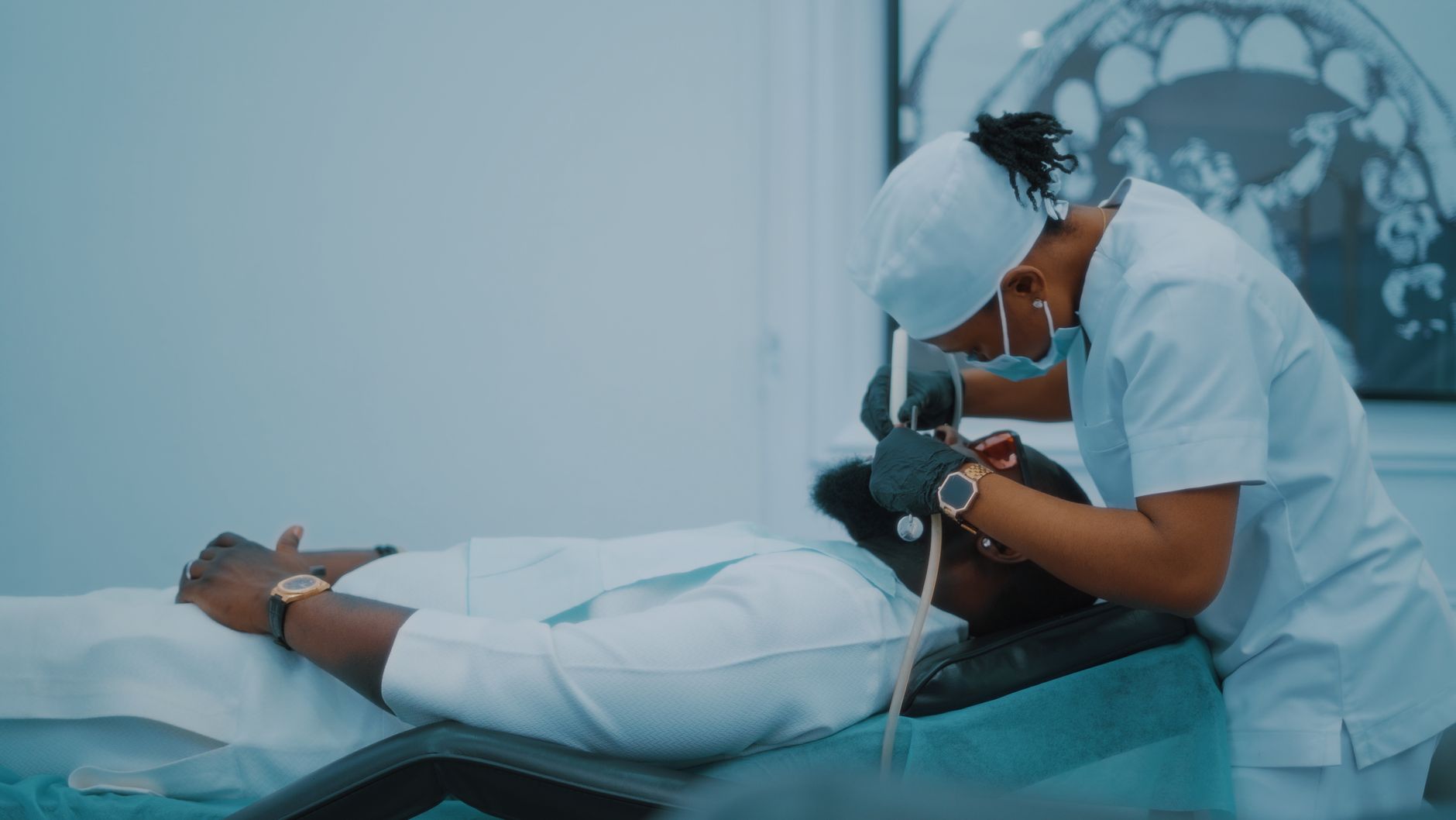 A dental professional performs a procedure on a patient in a Lagos clinic. — Why we choose cbd oil and hemp oil for health be