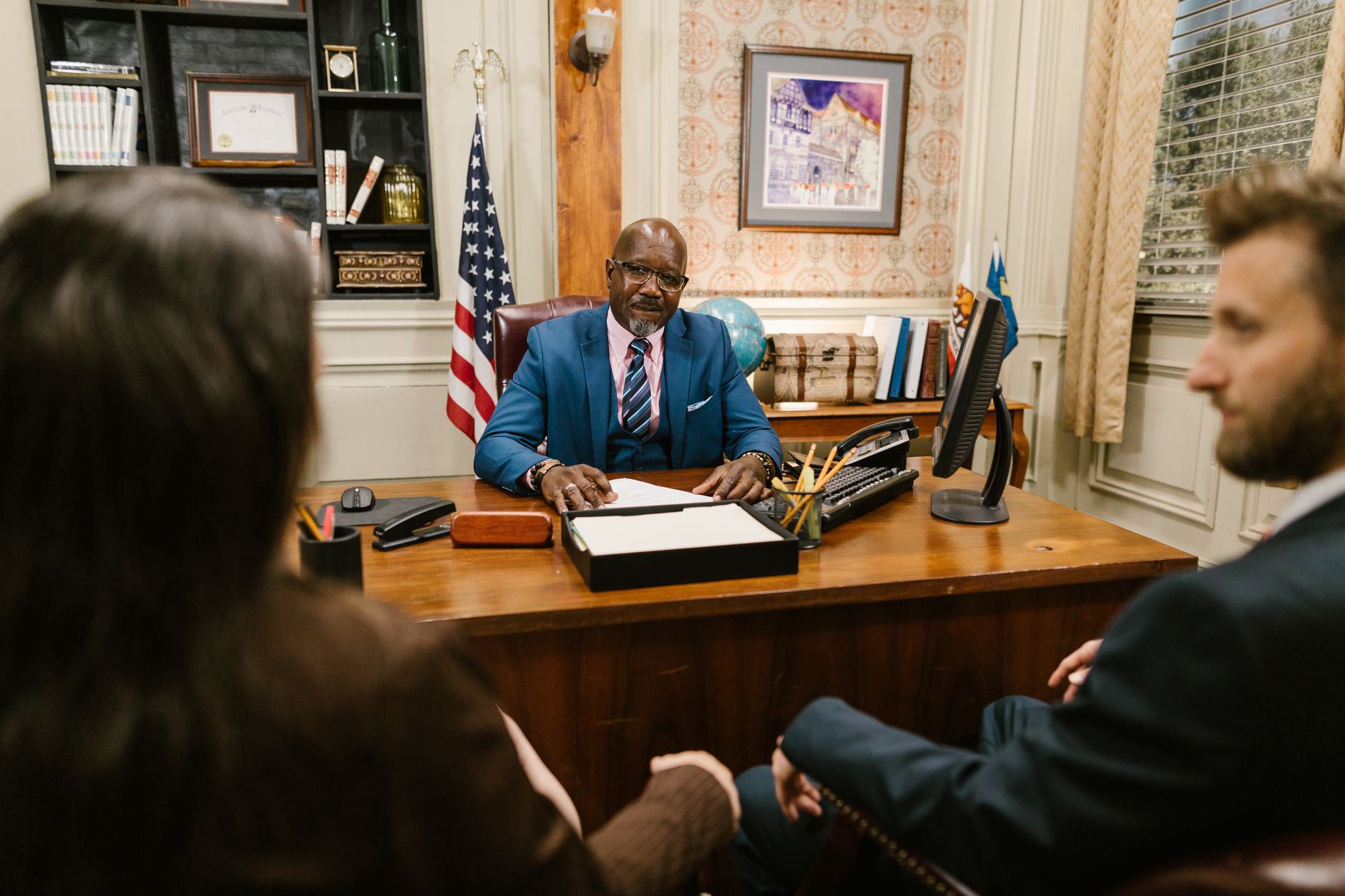 A professional lawyer meeting with clients in his office at a legal consultation. — Working with a Car Accident Attorney? Kno